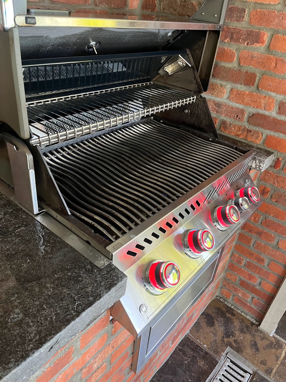 Napoleon built-in grill against brick